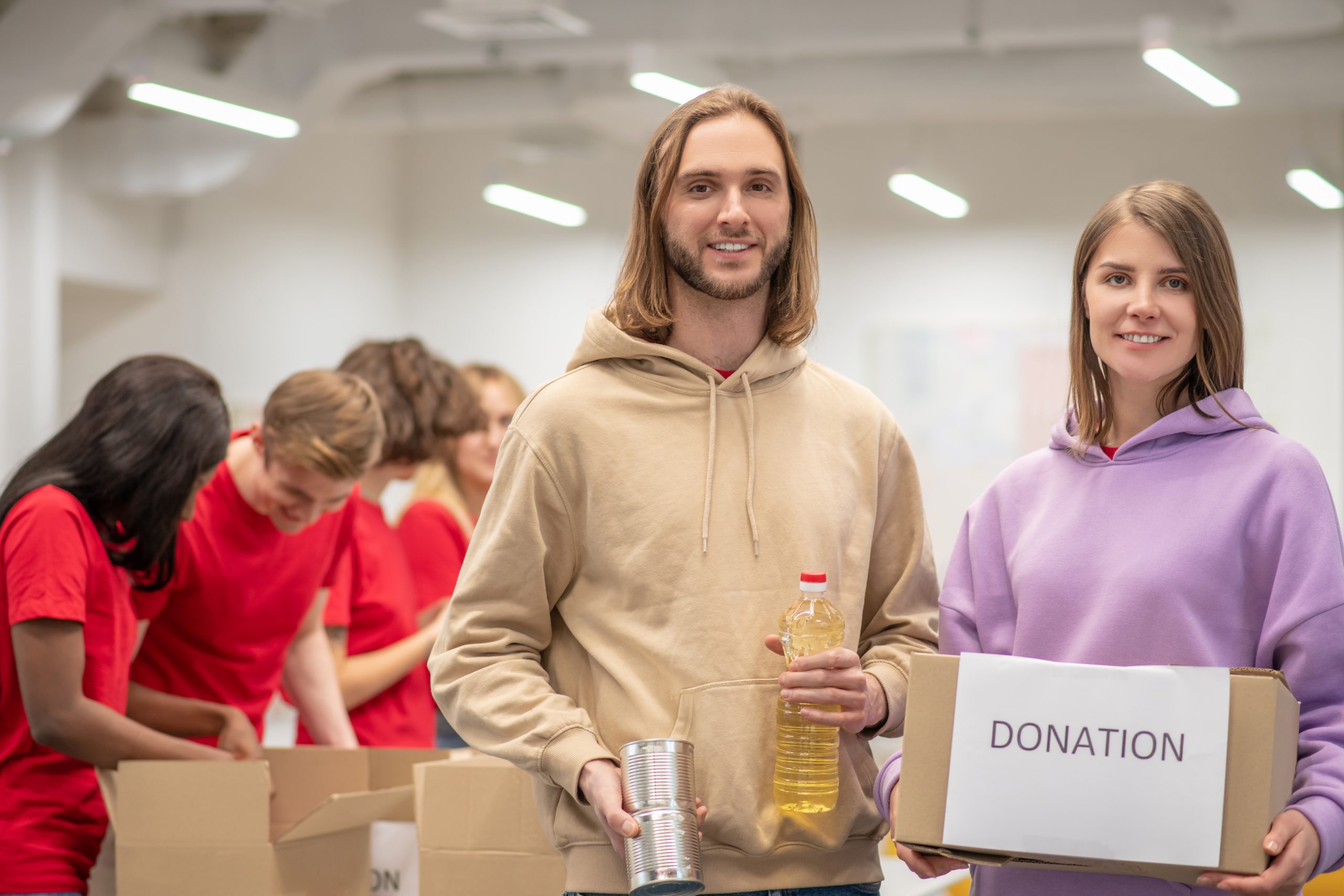 Charity volunteers collecting donations together.