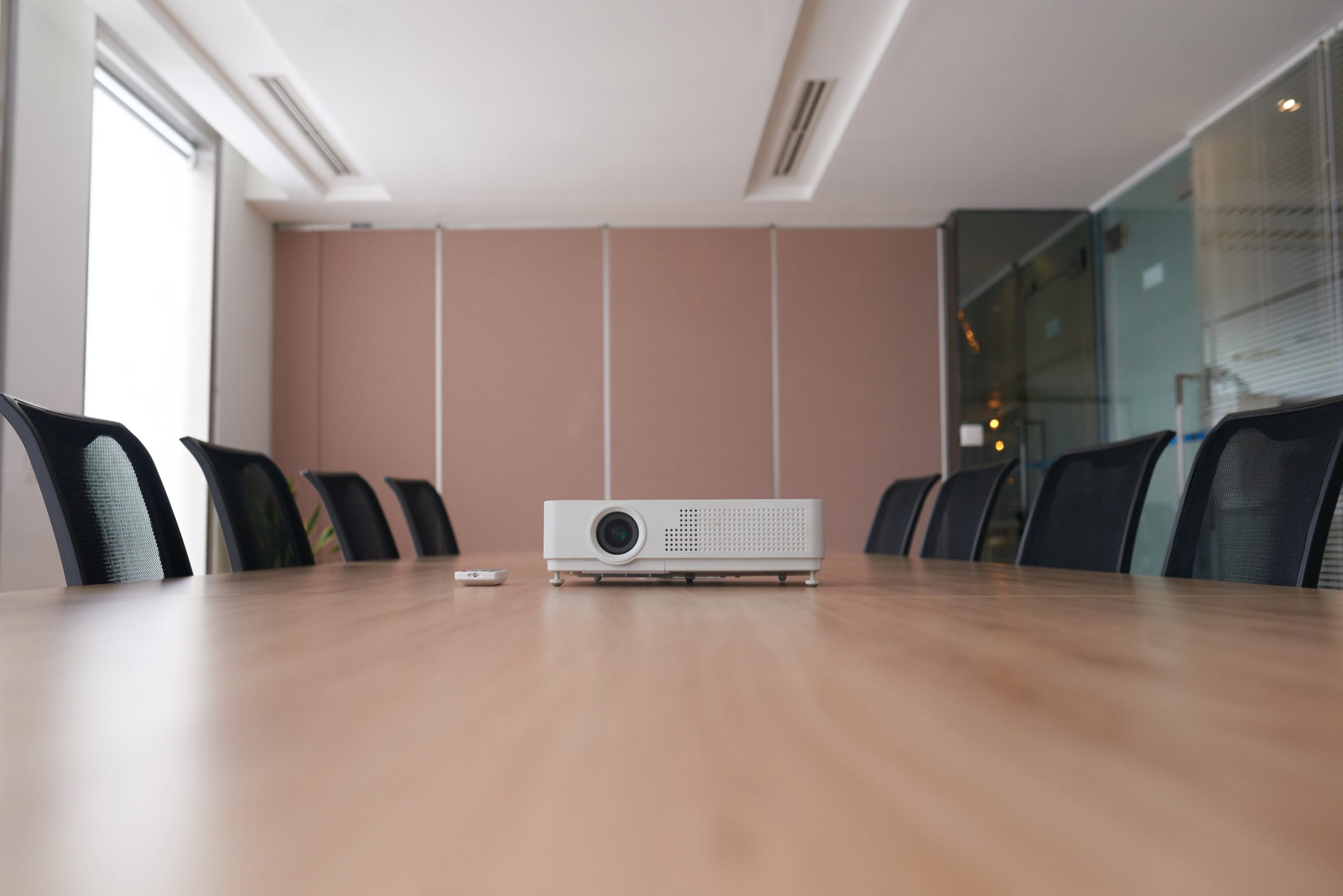 Projector on empty table in meeting room