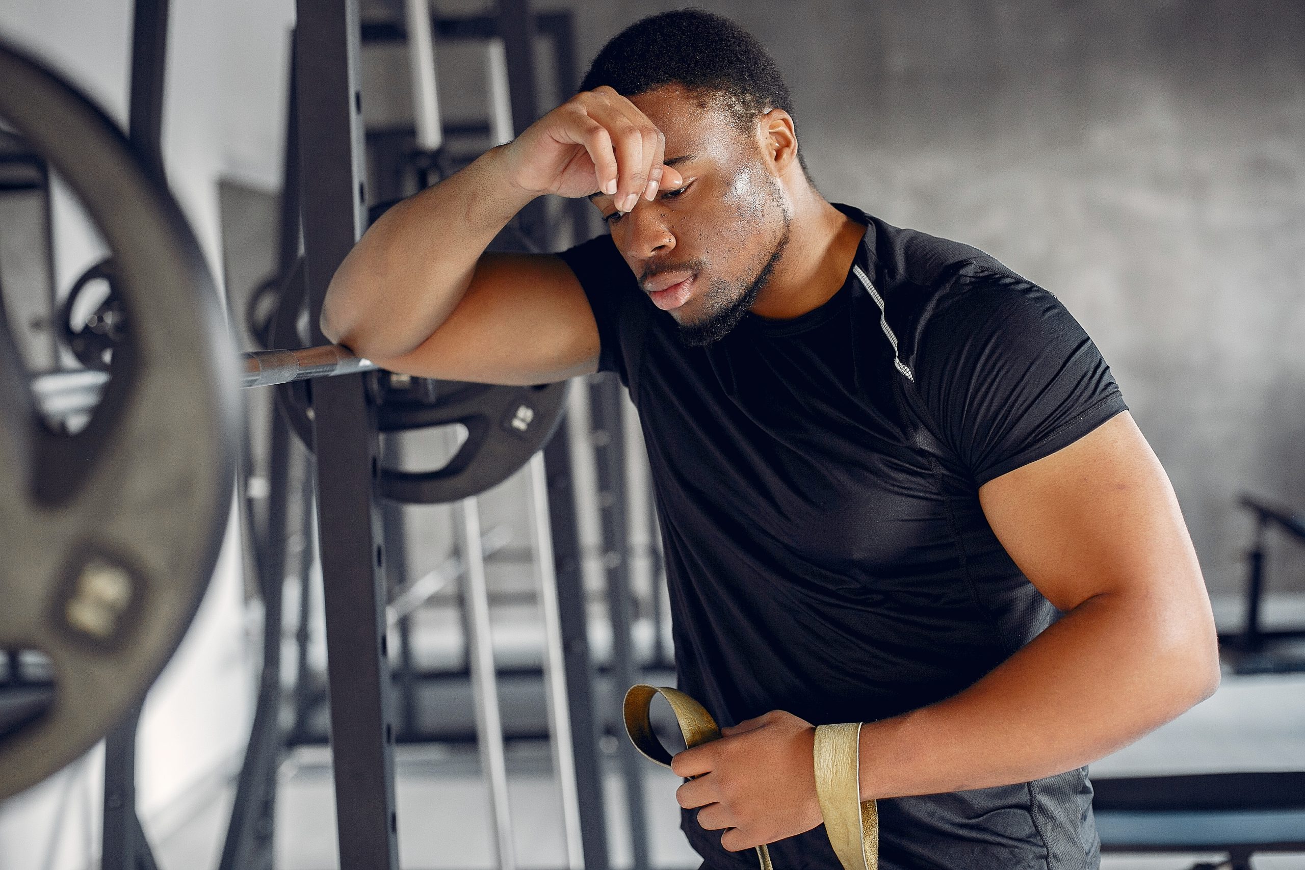stressed man working out in gym