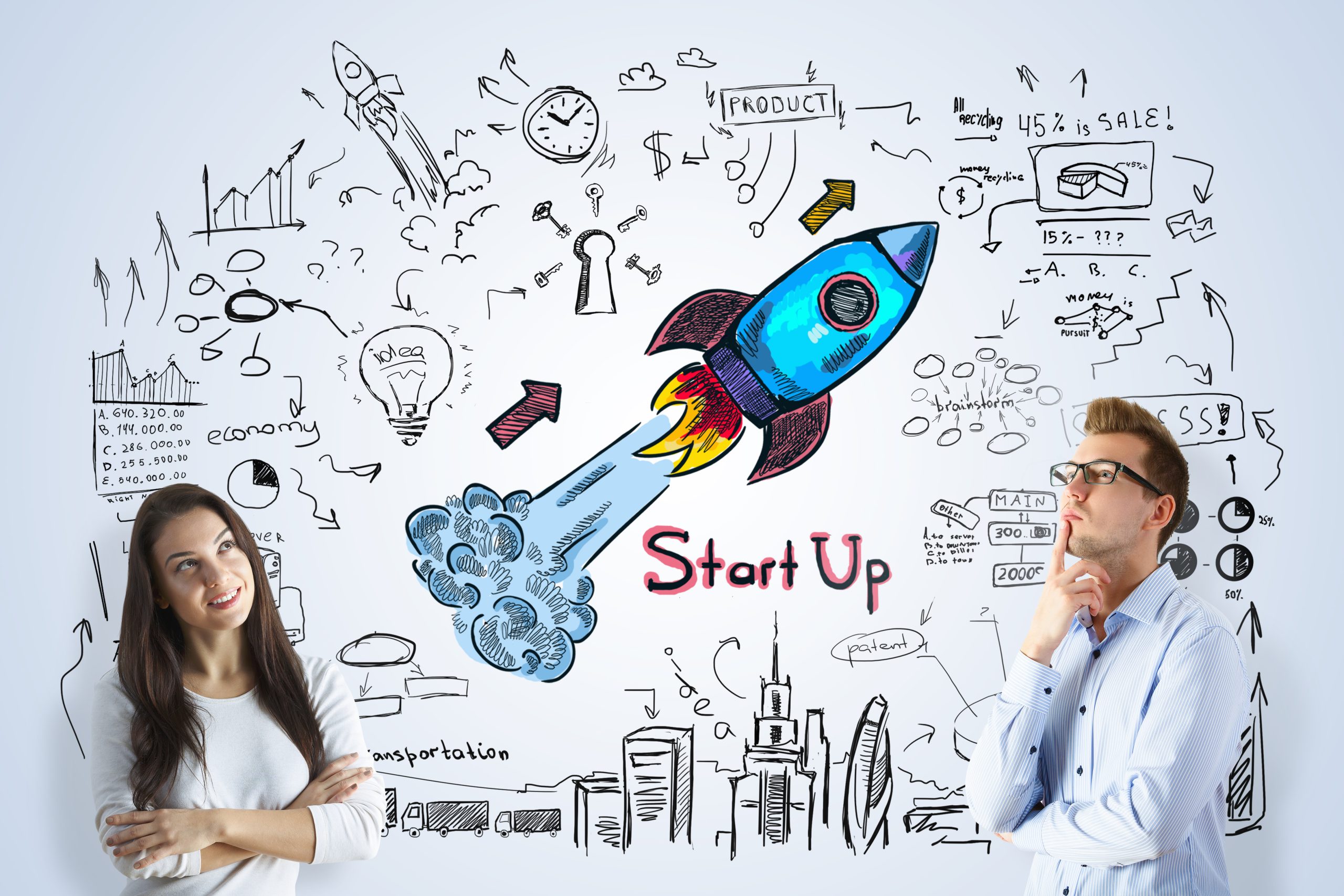 Startup business owners with drawing in background of ideas and a rocket lifting off
