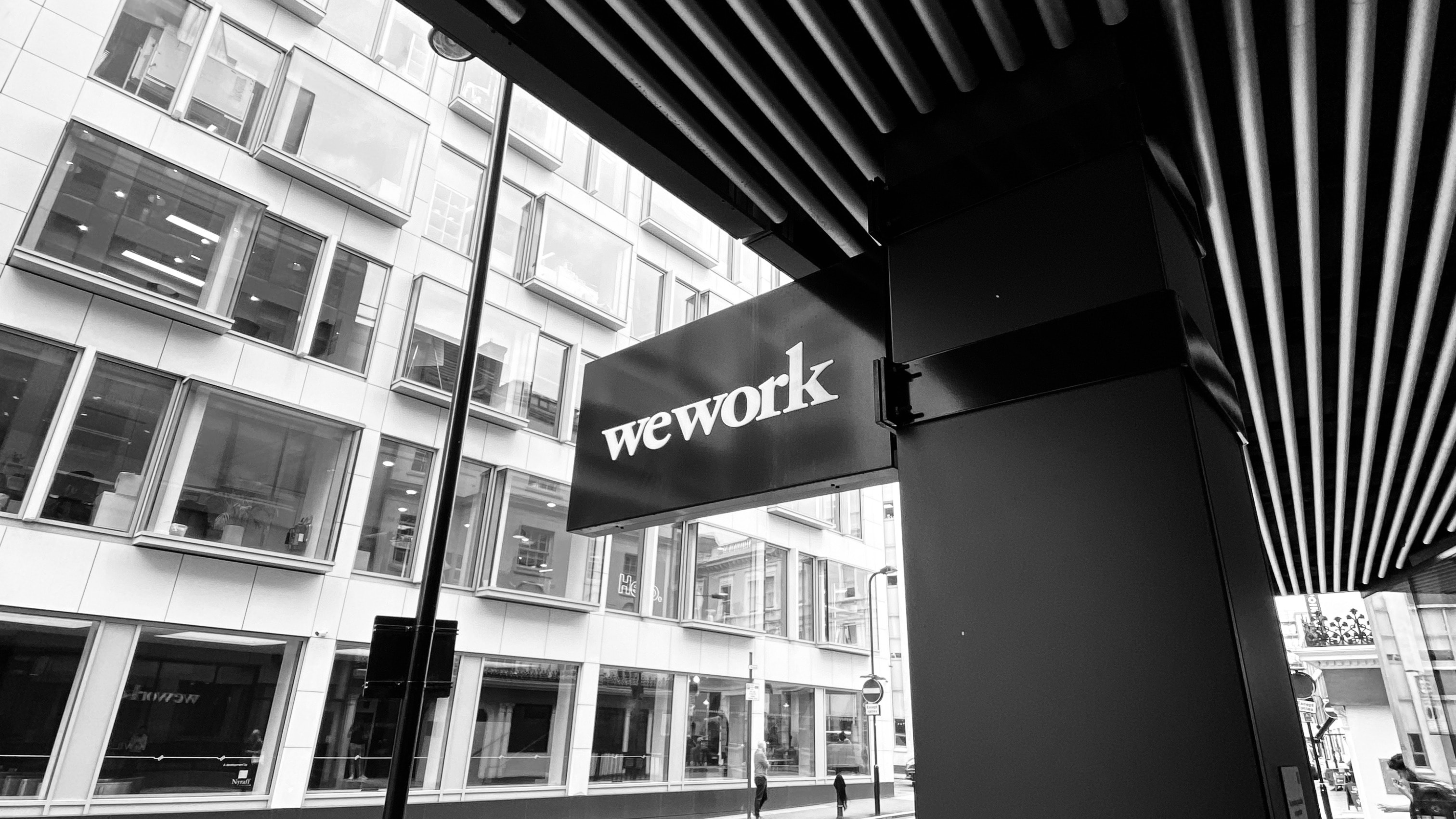 Black and white street with a wework sign